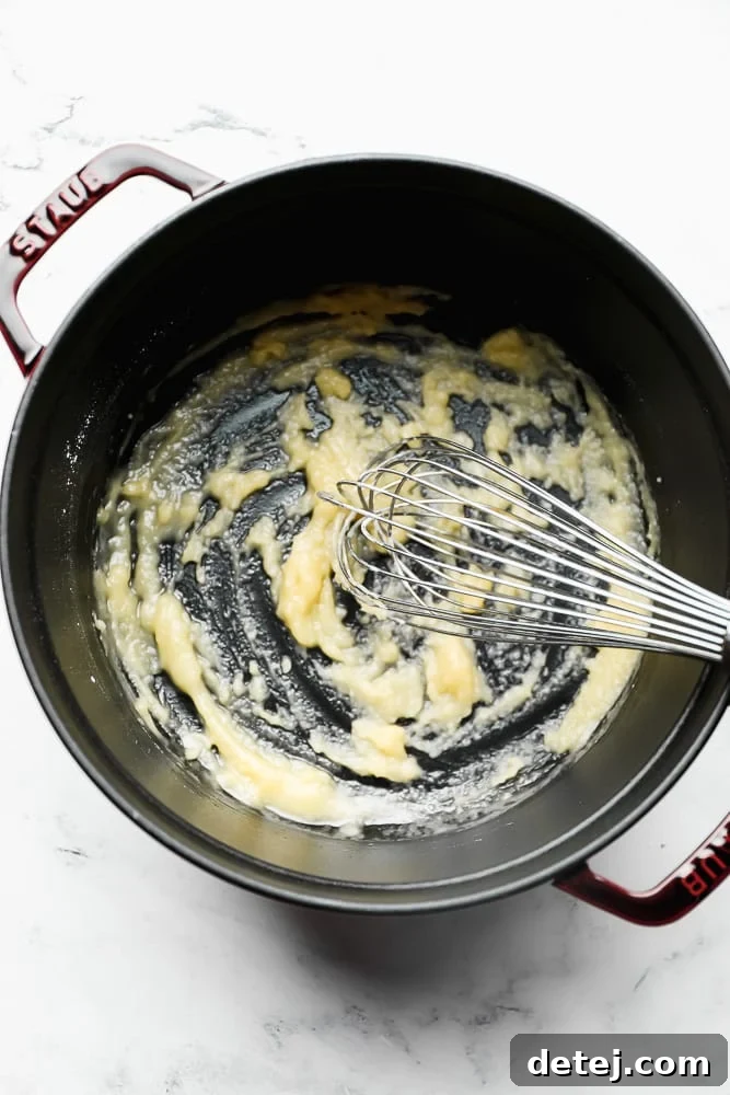 whisking flour, butter in a pot