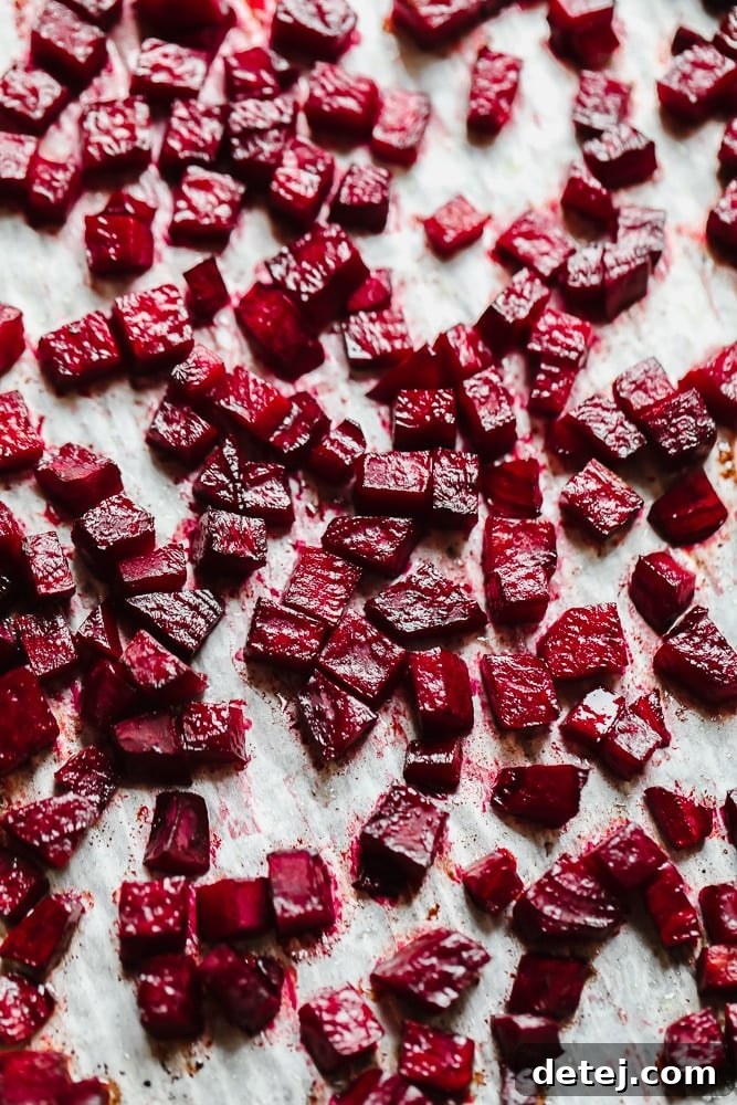 Crimson Velvet Risotto 3 Roasted beets diced and spread out on parchment paper on a baking sheet.