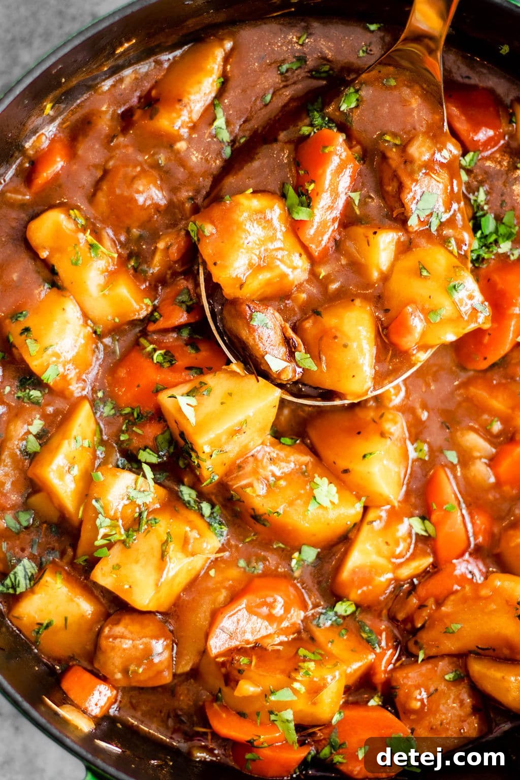 Close-up shot of vegan Irish stew simmering in a pot, showcasing its rich texture and steam, ready to be served.