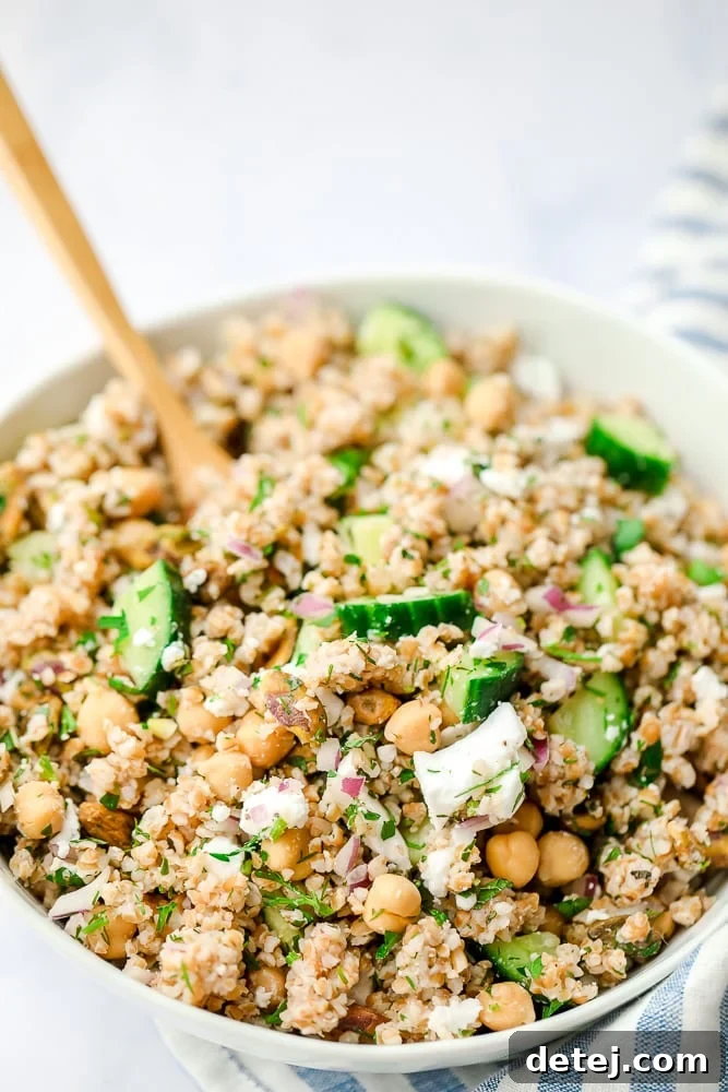 close up of a bowl of bulgur salad with cucumbers