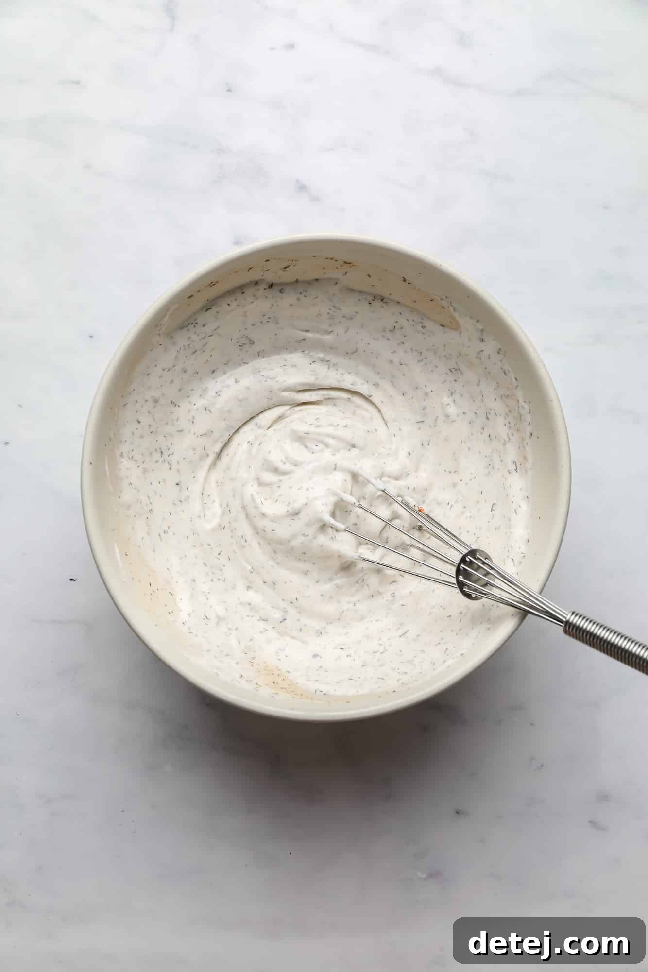creamy vegan ranch dressing in a white bowl.