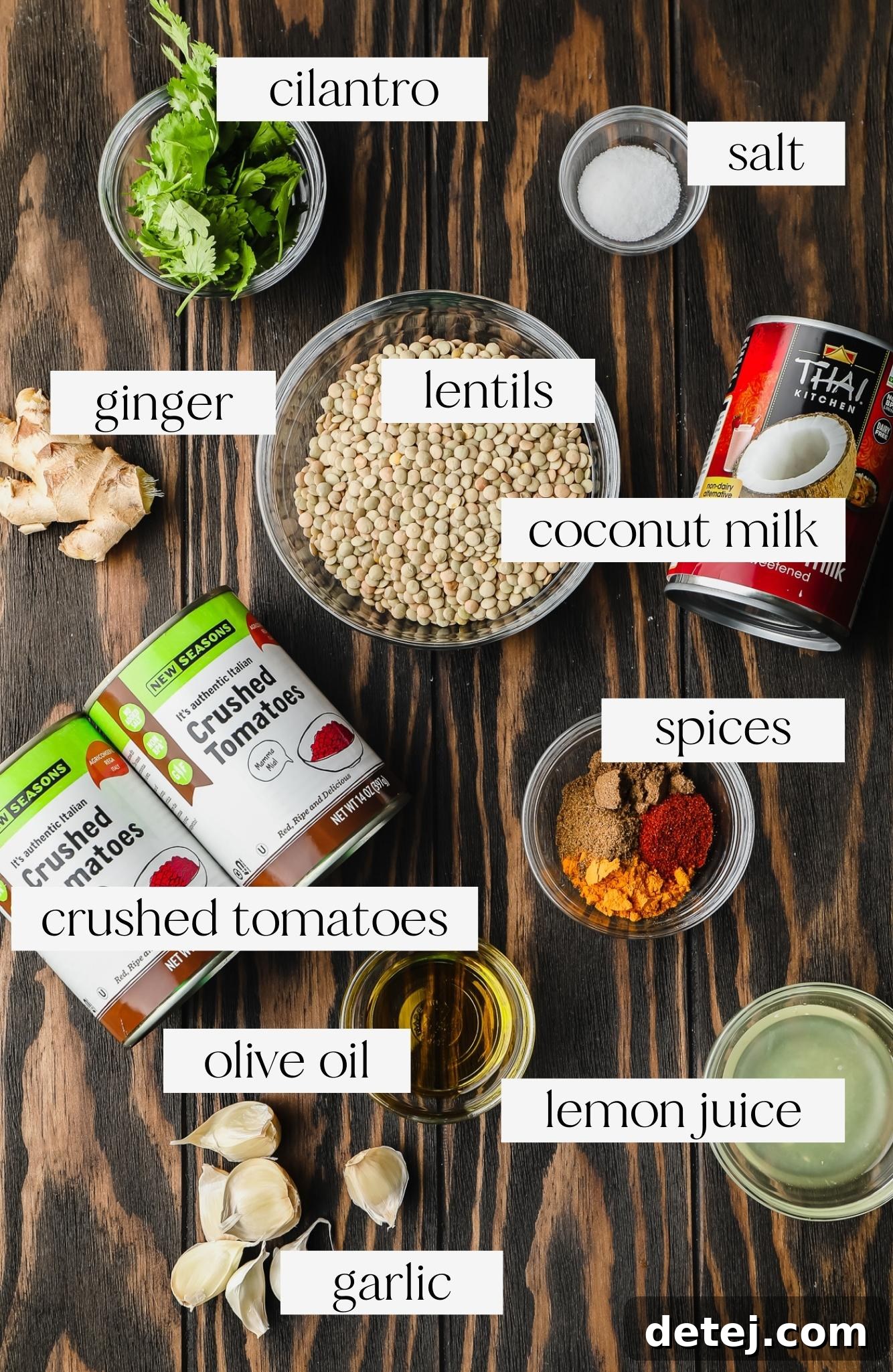Individual bowls showcasing the fresh ingredients required for making lentil curry, including lentils, spices, ginger, and garlic.
