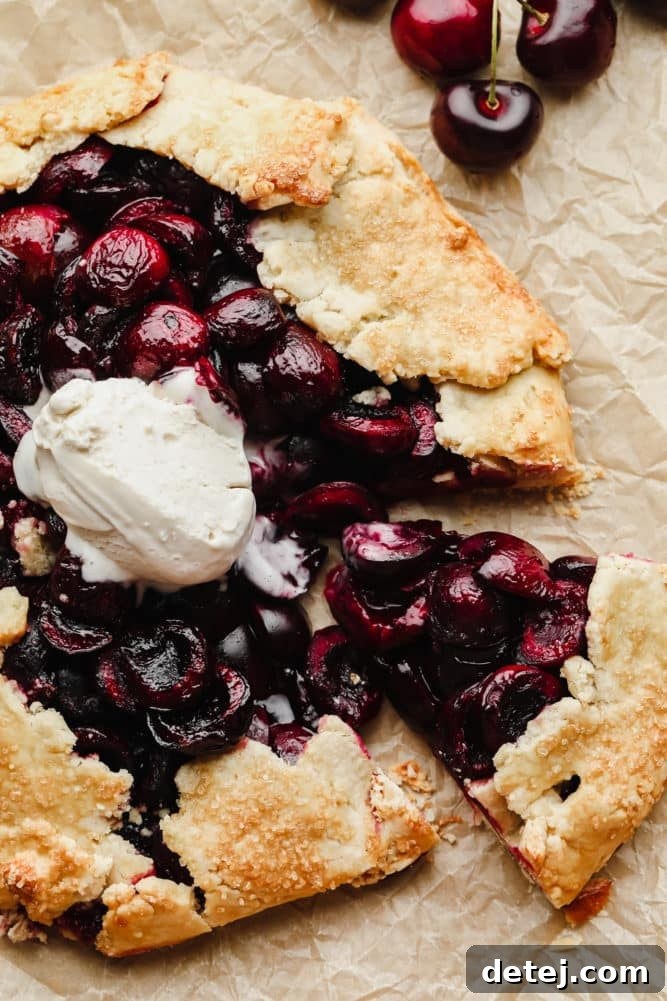 Rustic Cherry Tart 5 close up of galette with cherries and vanilla ice cream