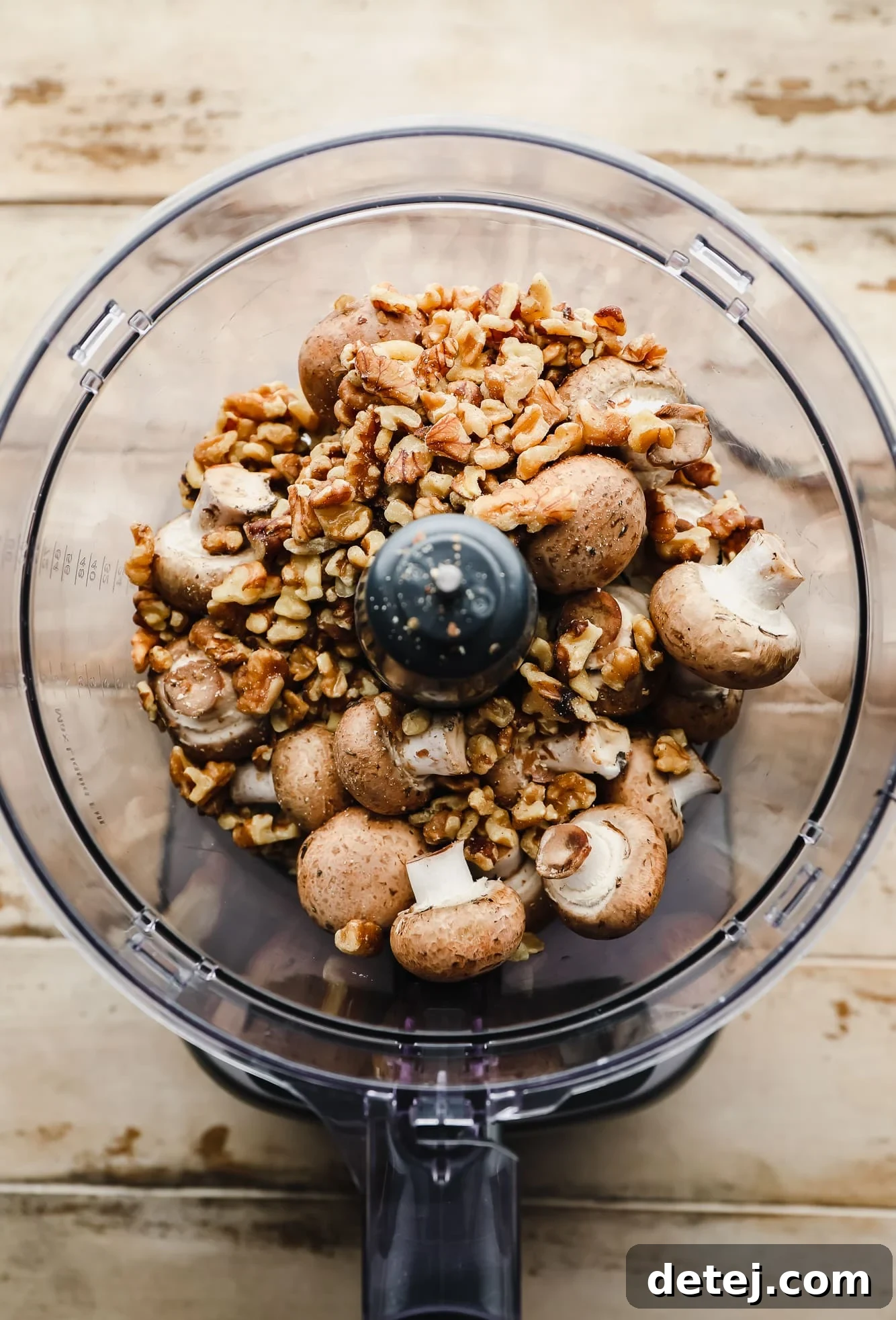 Your New Favorite Vegan Tacos 3 Fresh button mushrooms and shelled walnuts ready to be pulsed in a food processor, highlighting the simple ingredients for the vegan taco meat.