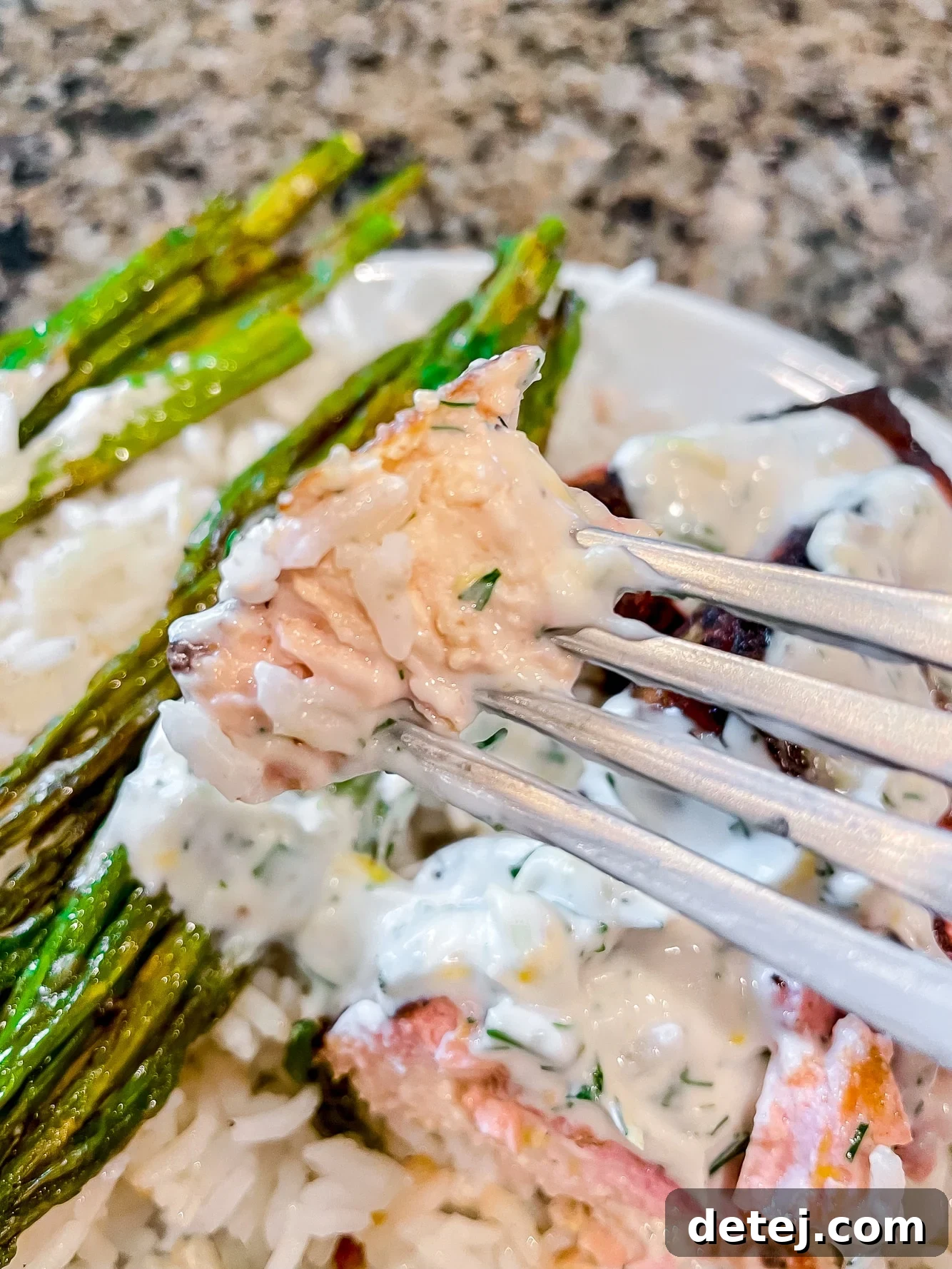 close up on a fork holding a bite of vegan salmon.