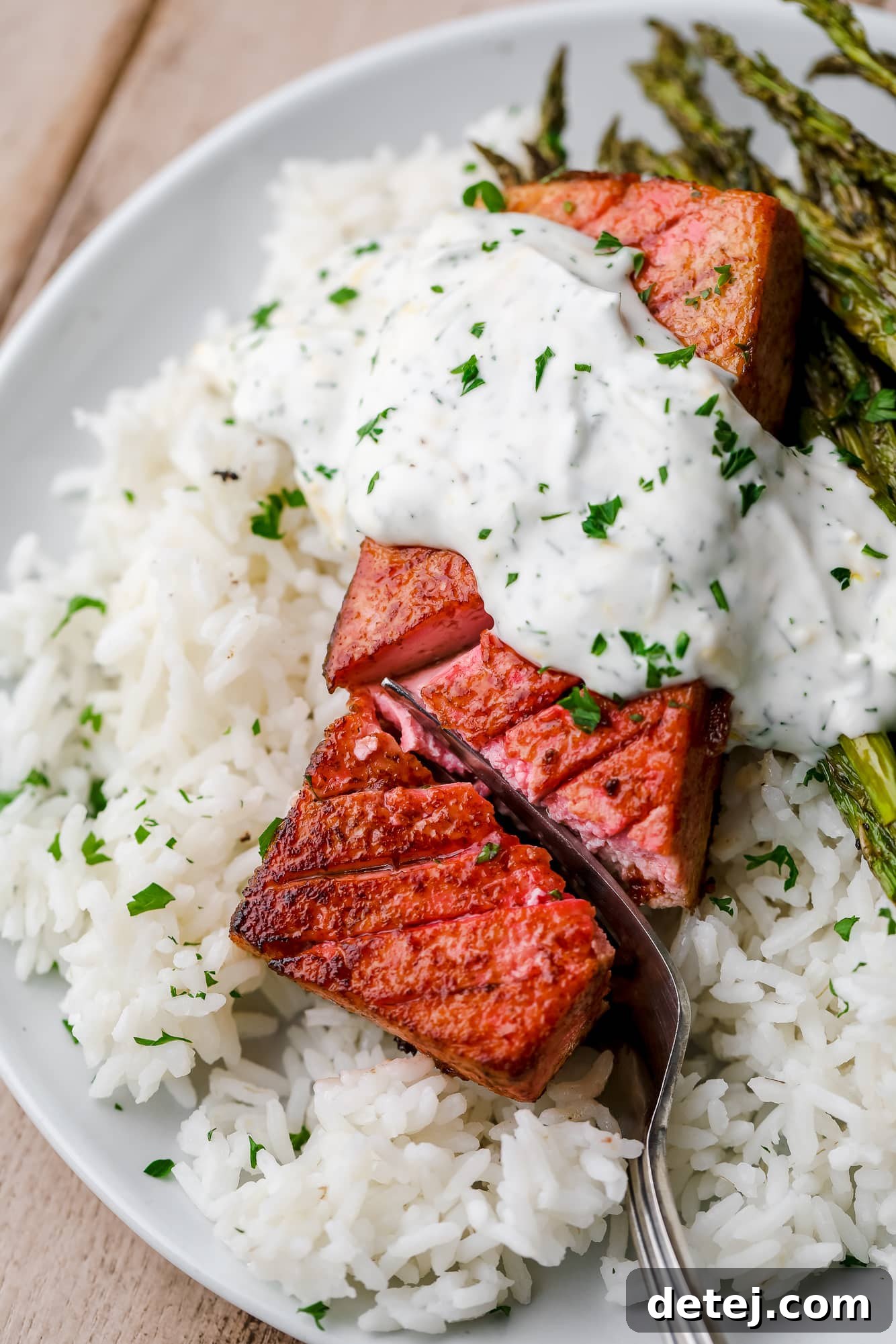 a fork cutting into a piece of vegan salmon.