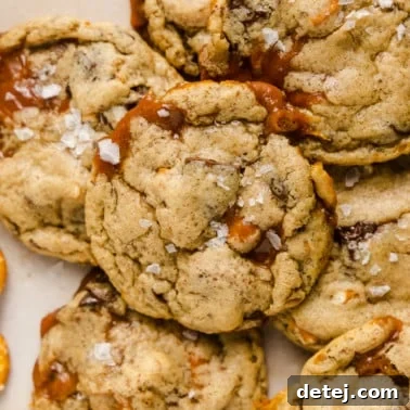 Close up on baked vegan kitchen sink cookies, showcasing their inviting texture and rich mix-ins.