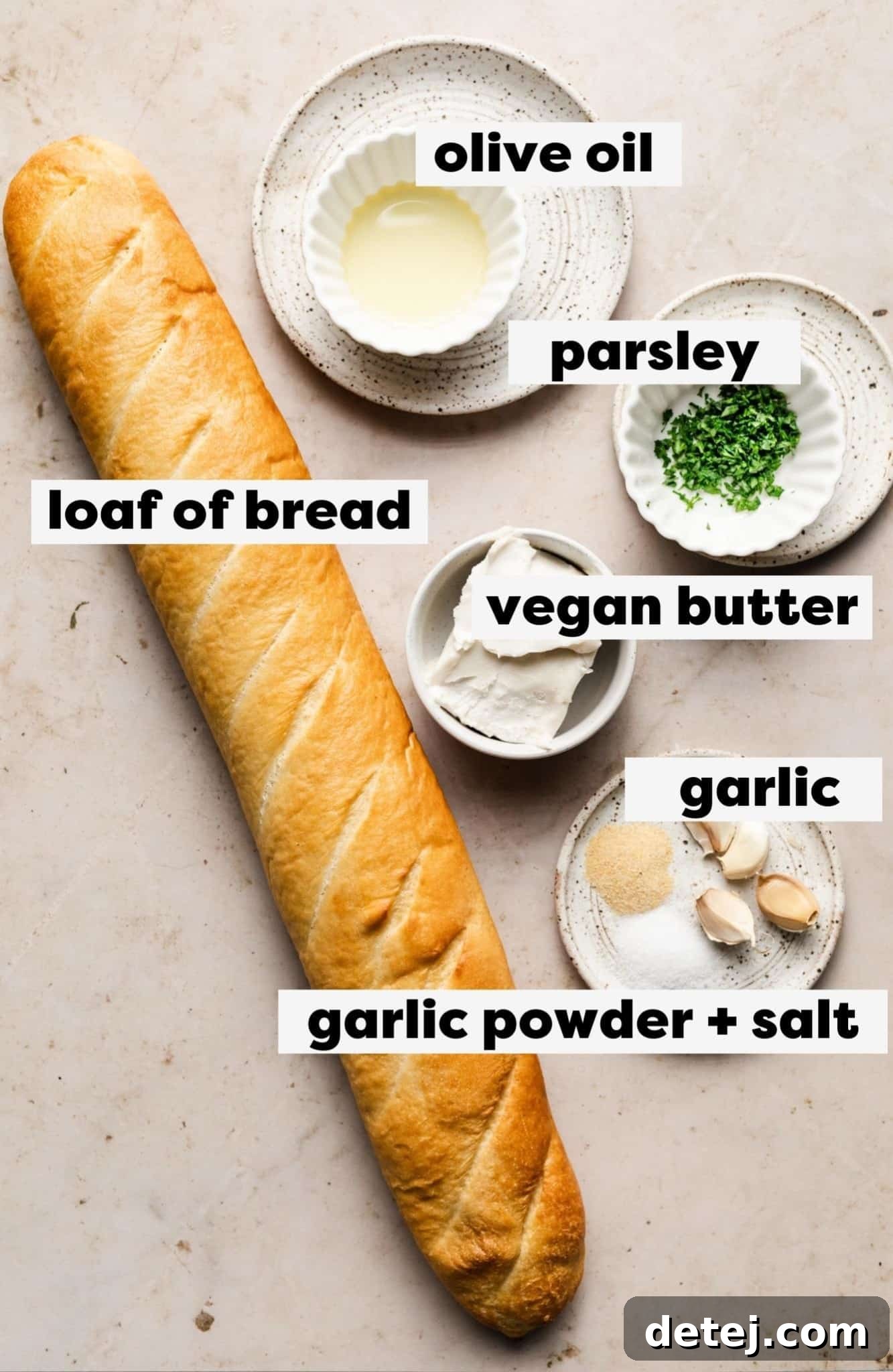 ingredients with labels for vegan garlic bread in small white bowls.