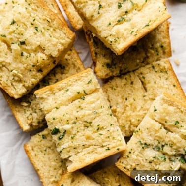 slices of vegan garlic bread piled on top of each other.