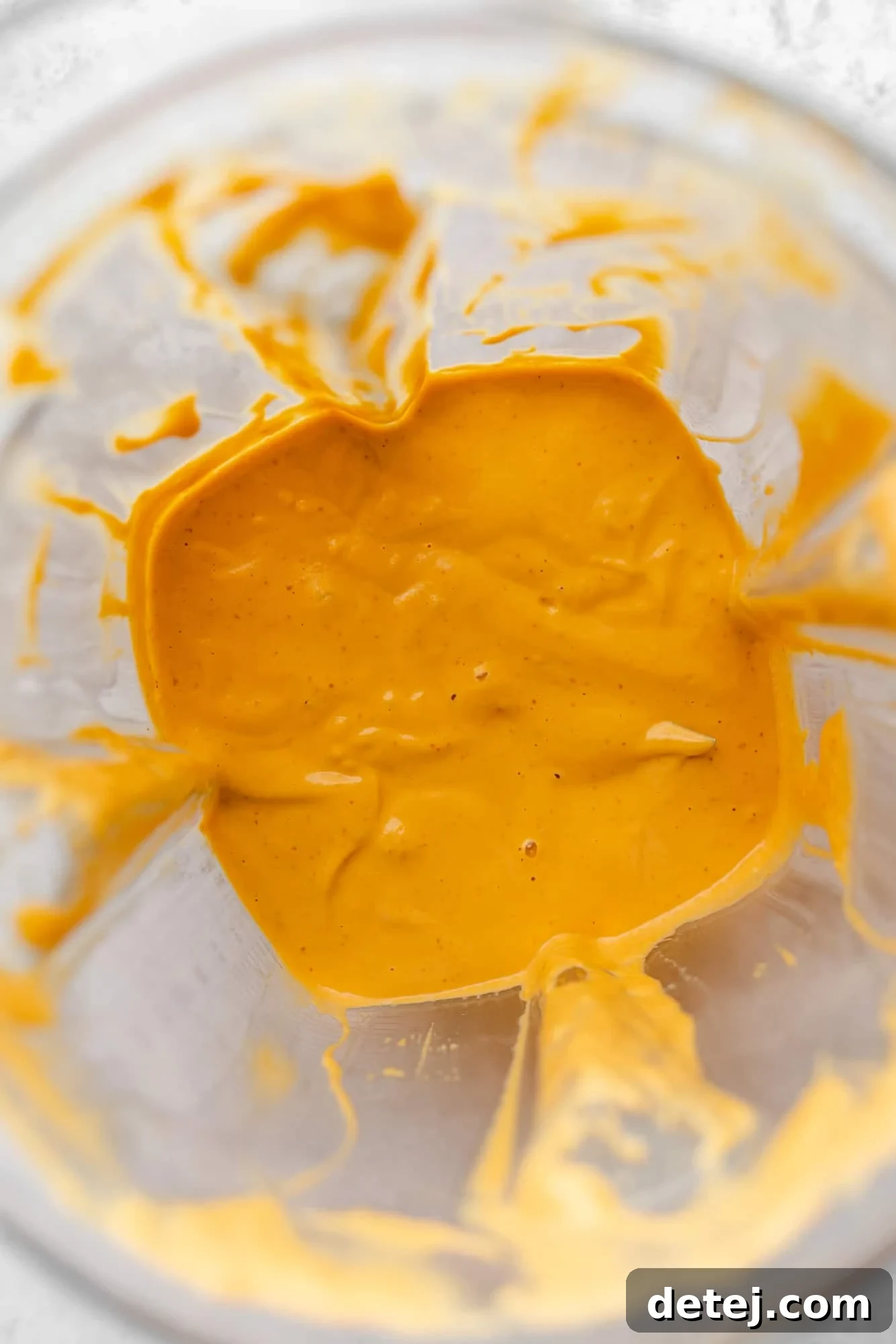 Smoky Chipotle Magic 6 The perfectly blended orange chipotle sauce inside a blender, showcasing its smooth texture.