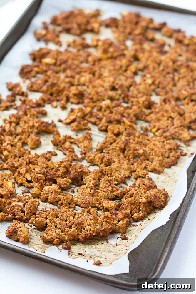 crumbled baked tofu on a parchment lined pan.