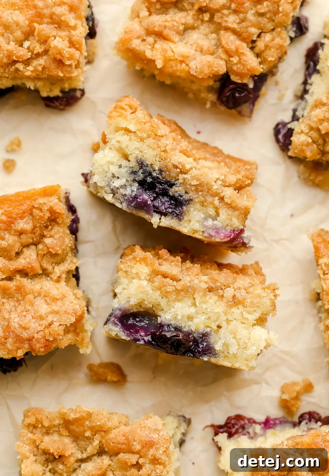 small slices of blueberry coffee cake turned on their sides.