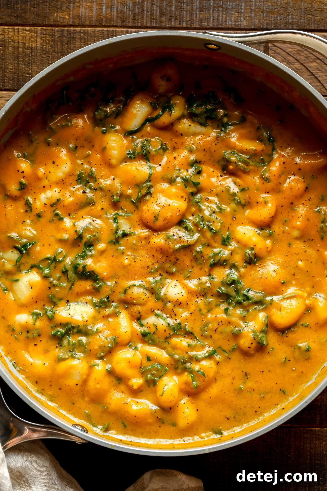 close up on a pot of cooked pumpkin gnocchi.
