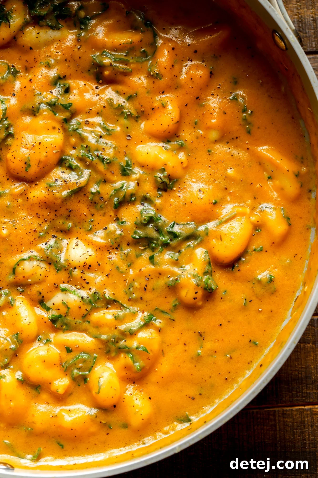 close up on a pot of cooked pumpkin gnocchi.