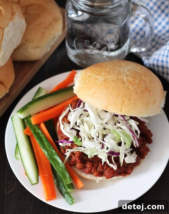 25 Effortless Vegetarian Instant Pot Creations 12 Smoky Lentil Sloppy Joes served on a burger bun with cabbage