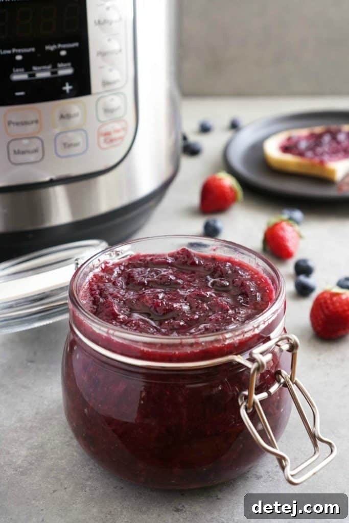 25 Effortless Vegetarian Instant Pot Creations 26 Homemade Instant Pot Berry Jam in a glass jar, perfect for toast or desserts