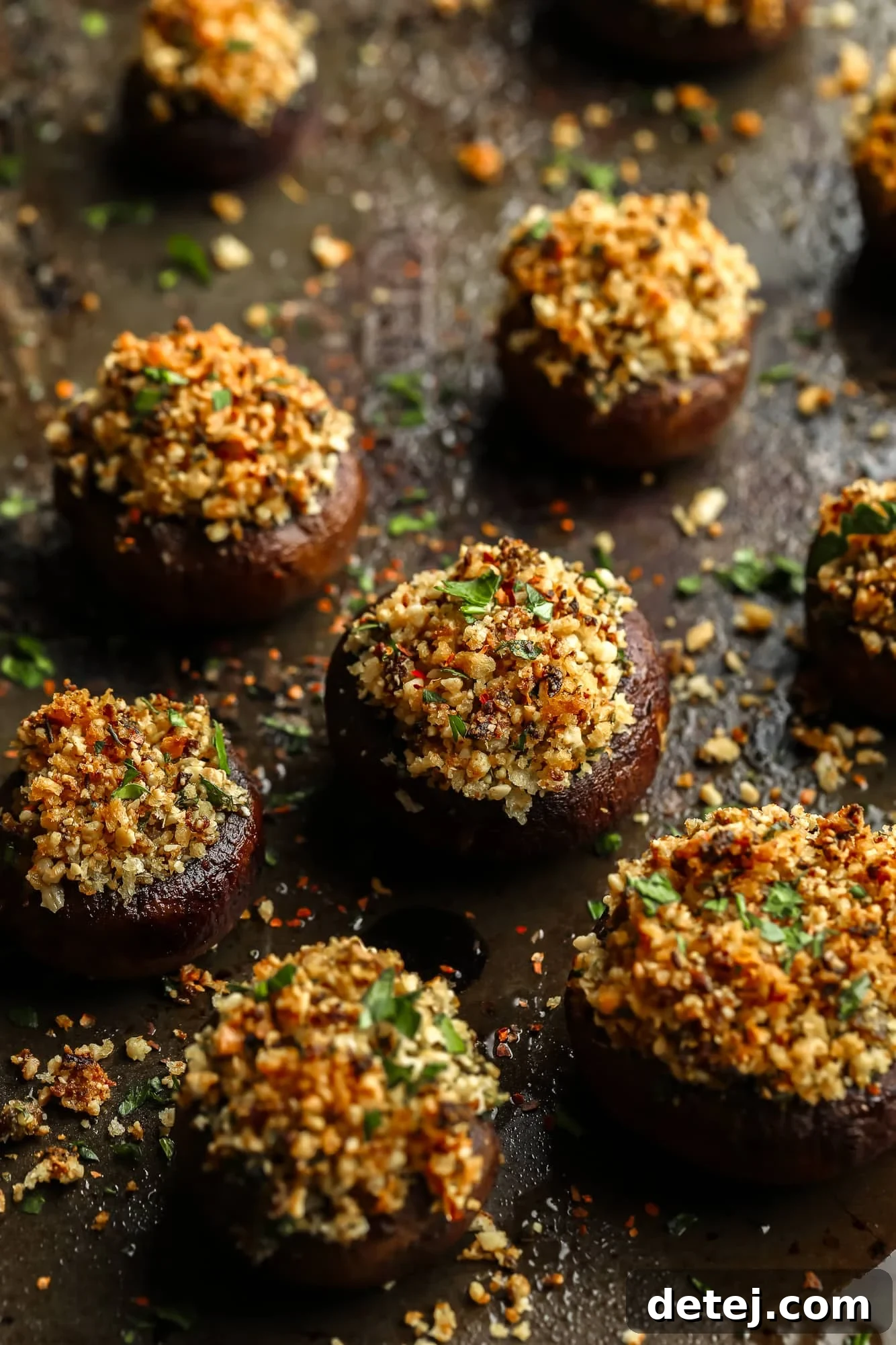 Savory Vegan Mushroom Delights 7 close up on baked stuffed mushrooms with a vegan parmesan and breadcrumb filling.