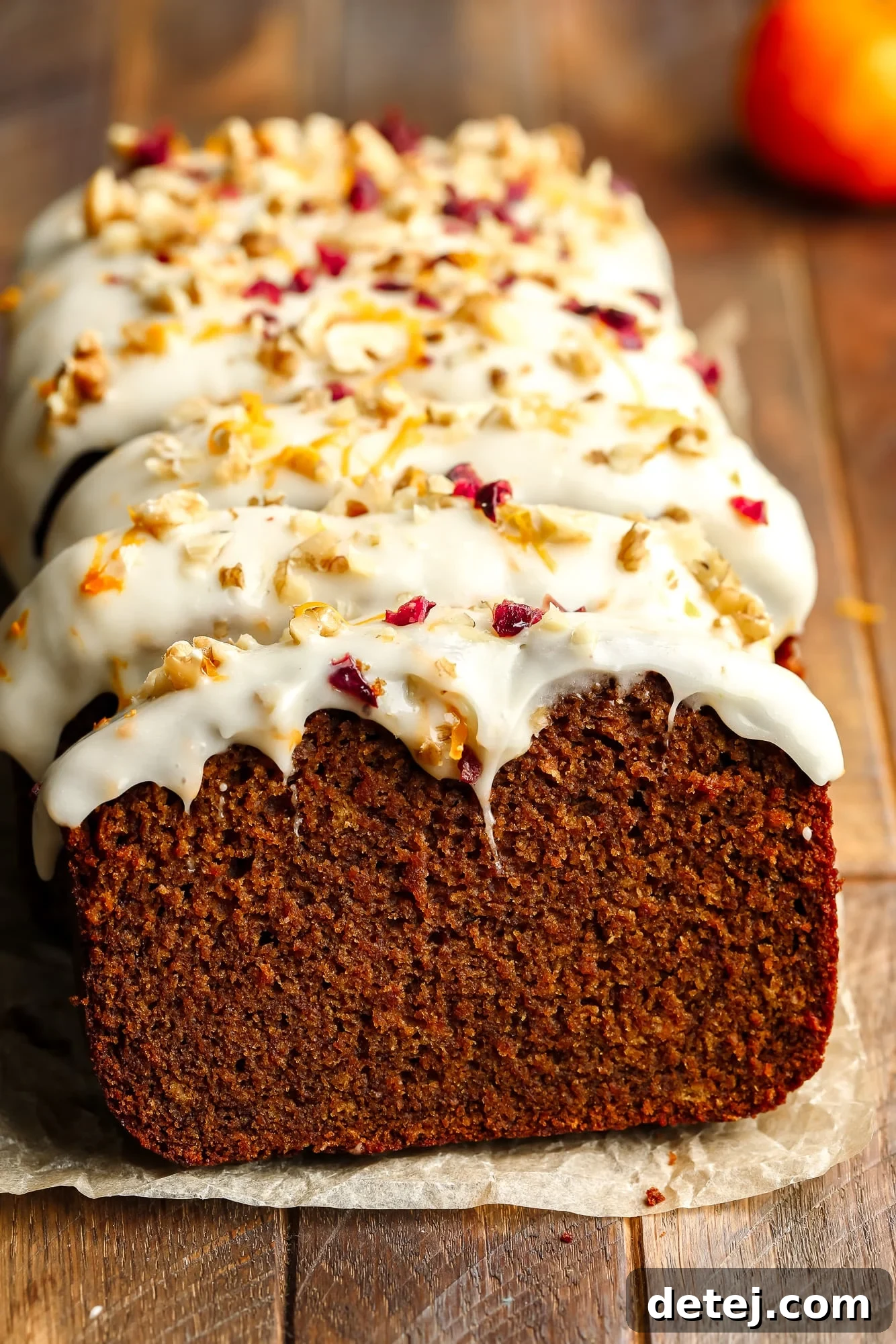 Cozy Gingerbread Bake 2 a sliced Gingerbread Loaf decorated with cream cheese frosting.
