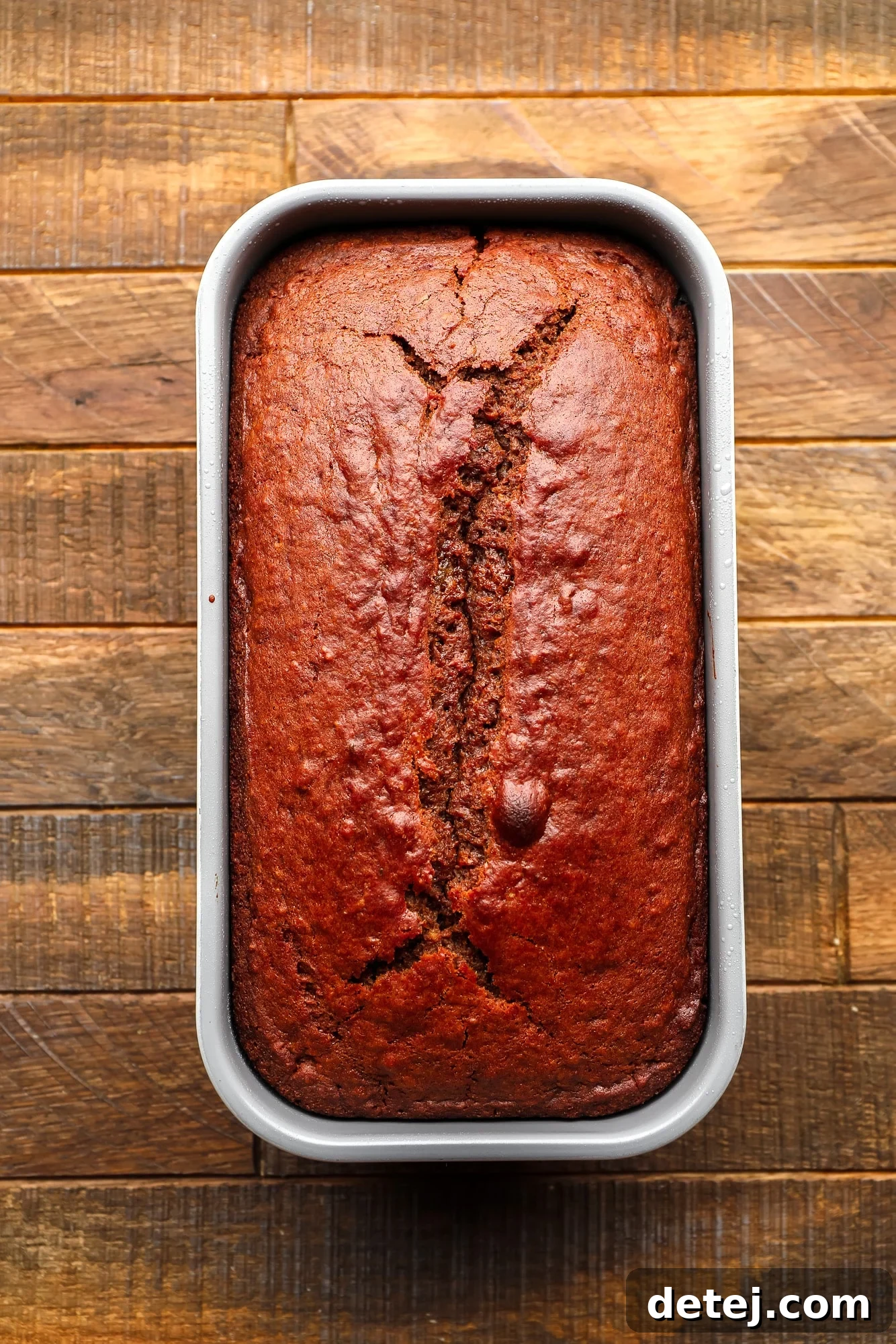 Cozy Gingerbread Bake 9 a baked gingerbread loaf in a loaf pan.