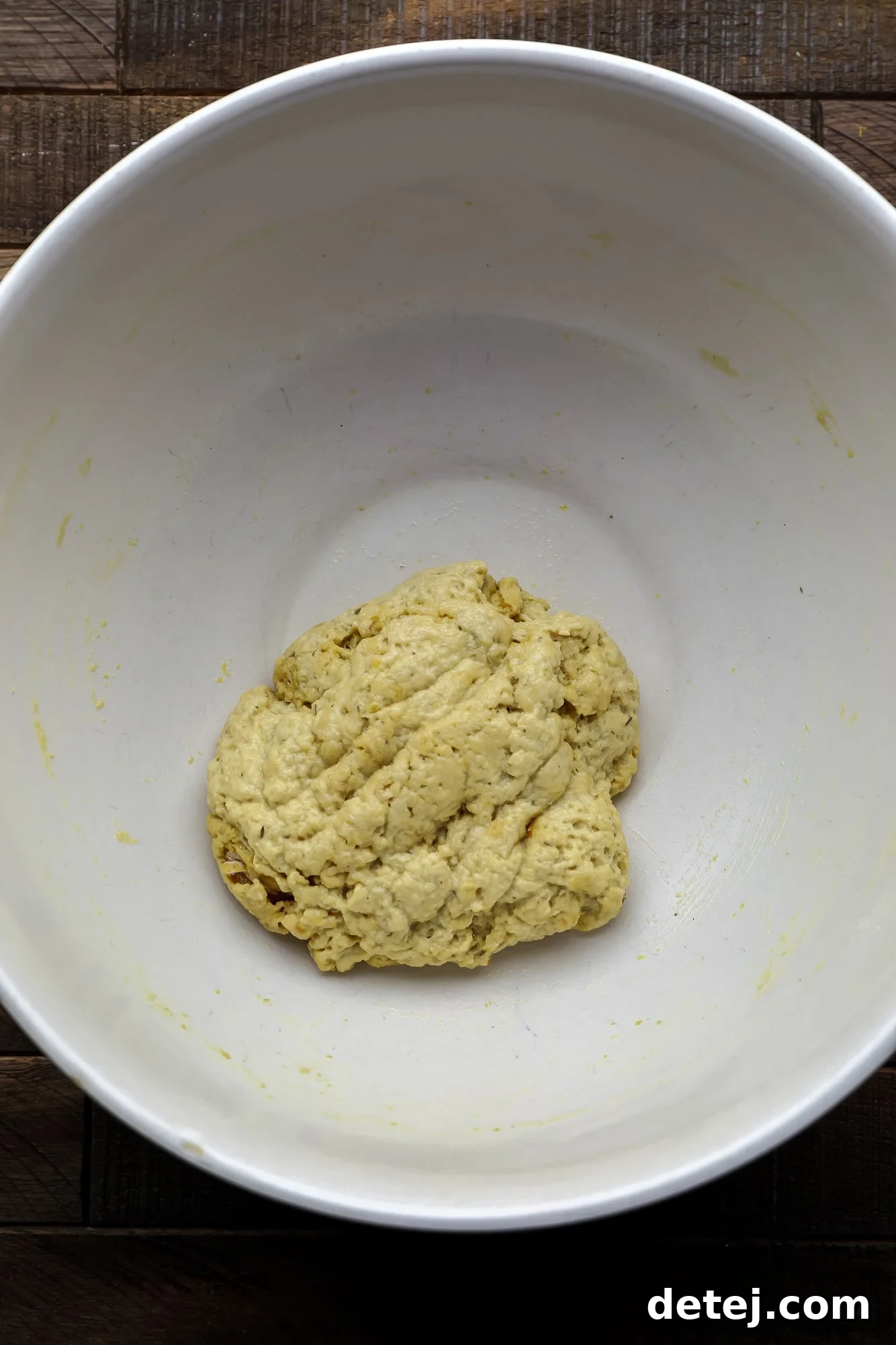 Effortless Seitan 4 a ball of seitan dough in a large white bowl.