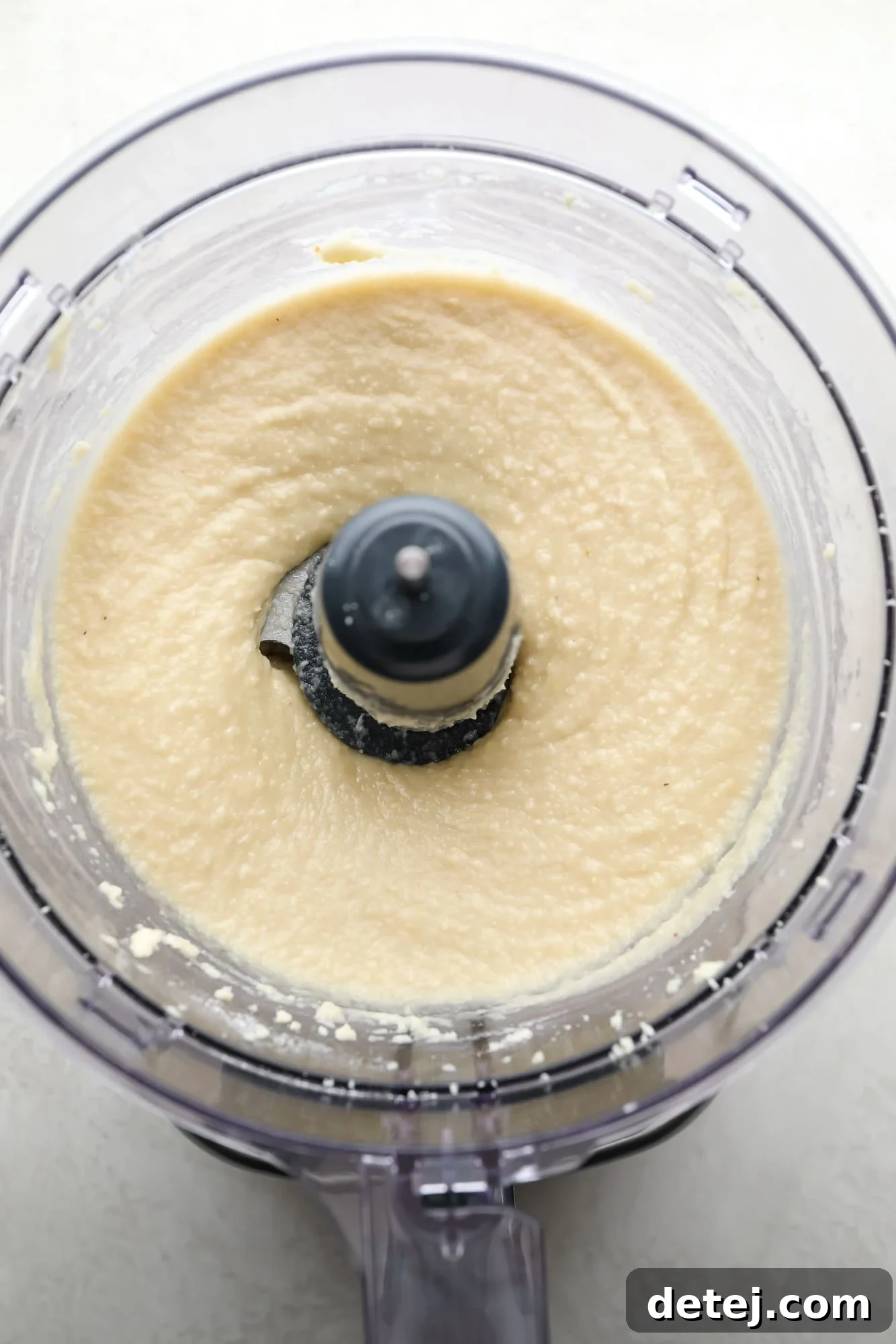 Smooth and creamy almond frangipane filling in a food processor, ready to be chilled and used.