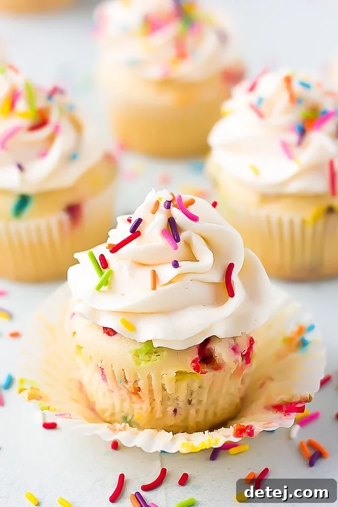 funfetti vegan cupcake with more in background