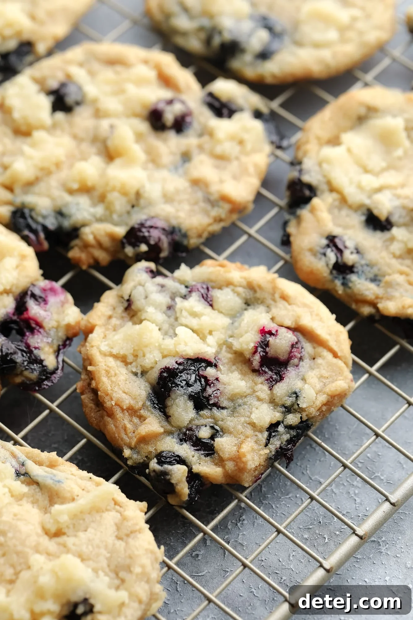 vegan blueberry cookies on a wire rack.