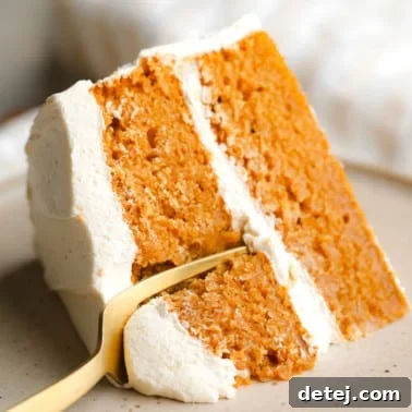 close up on a fork cutting into a slice of Pumpkin Spice Latte Cake.