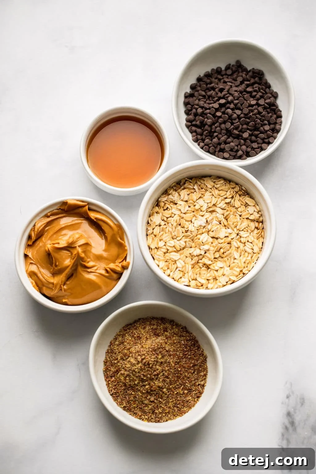 ingredients for Peanut Butter Energy Balls in individual white bowls.