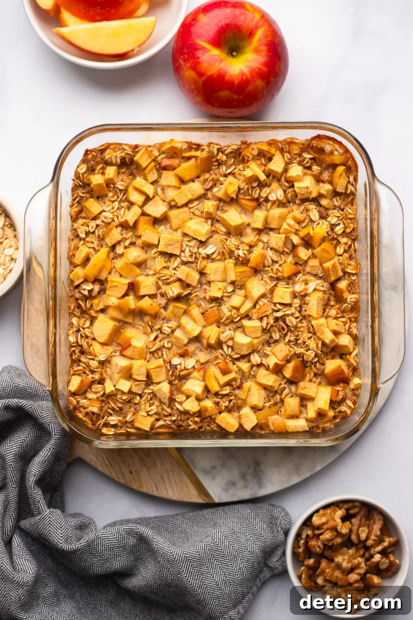 Warm Apple Oat Bake 2 Apple Baked Oatmeal in a glass baking dish, ready to be served.