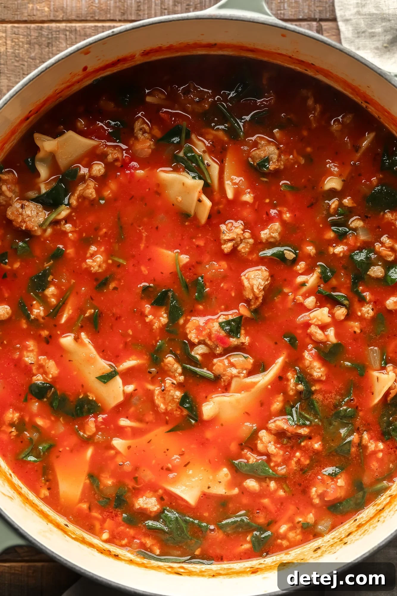 cooking vegan lasagna soup in a large pot.