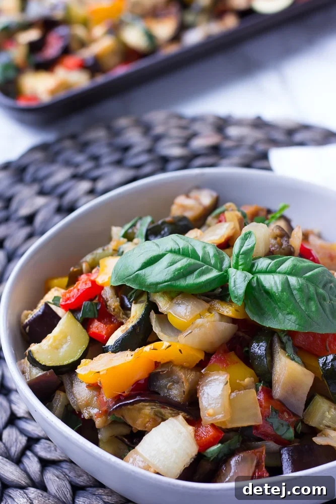 A bowl of vibrant Roasted Ratatouille, showcasing tender, colorful vegetables like eggplant, zucchini, and bell peppers.