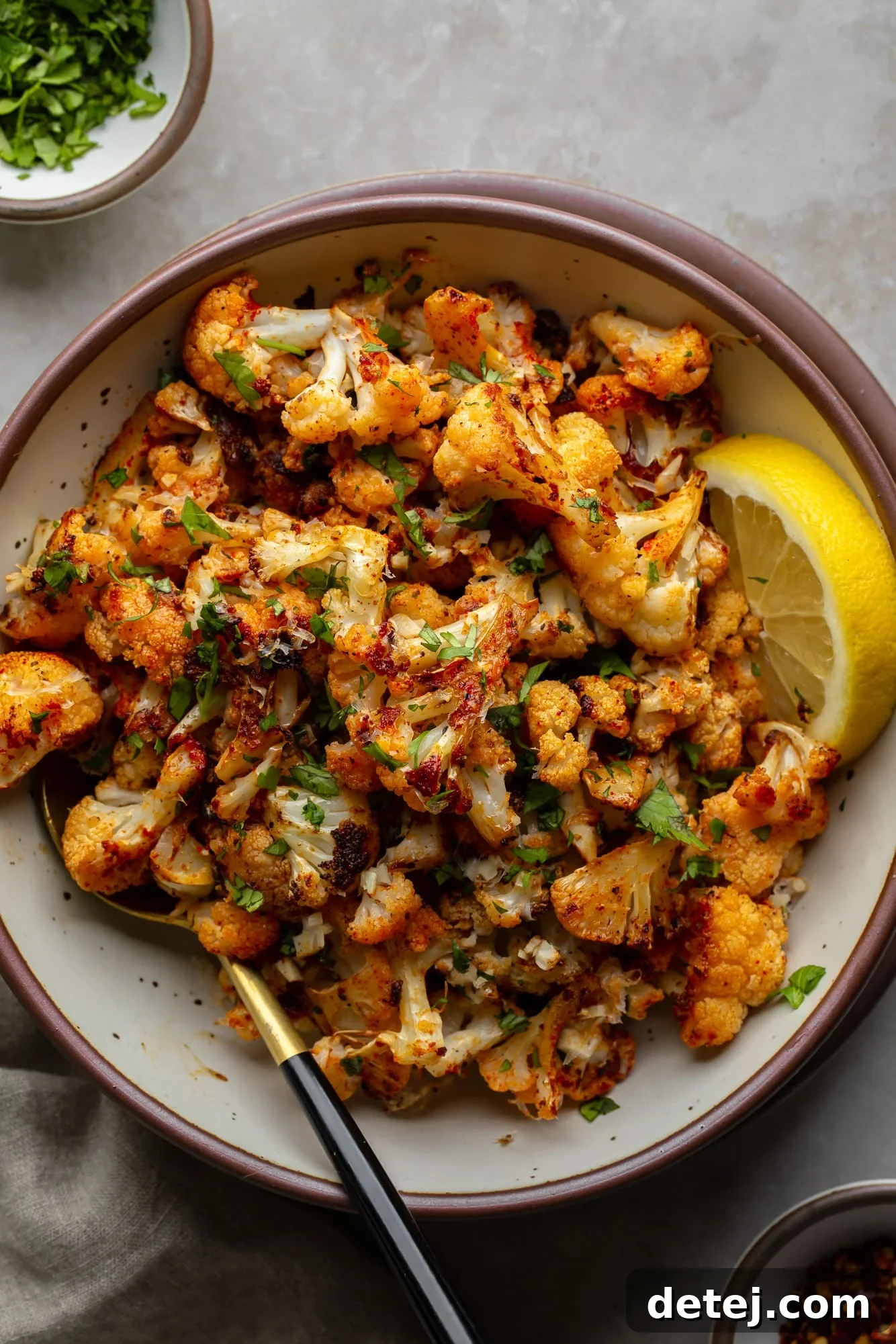 roasted cauliflower florets in a white bowl.
