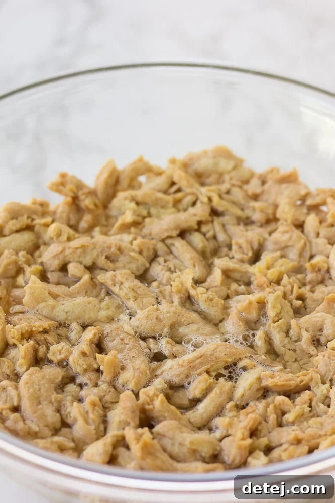 Ultimate Vegan BBQ Soy Curl Sandwich 3 soy curls being soaked in a bowl