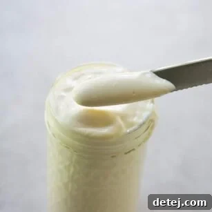 tofu mayonnaise in a jar and on a knife
