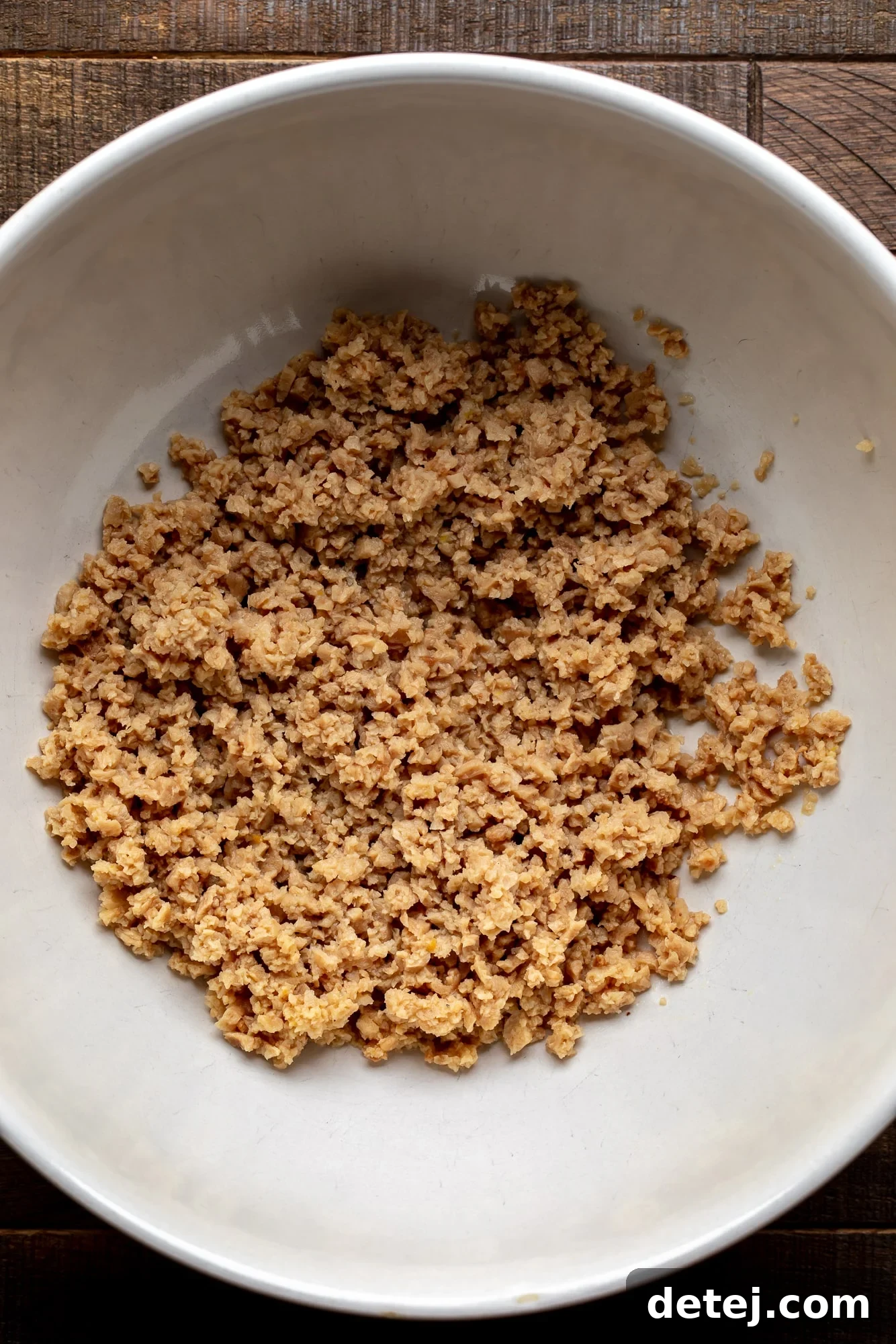 rehydrated soy crumbles in a large white bowl.