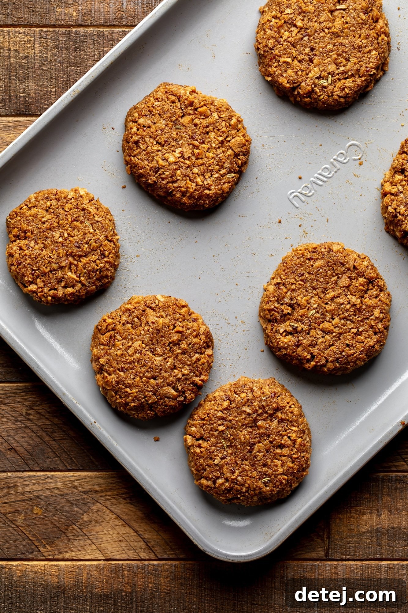 formed vegan breakfast sausage patties on a large baking sheet.