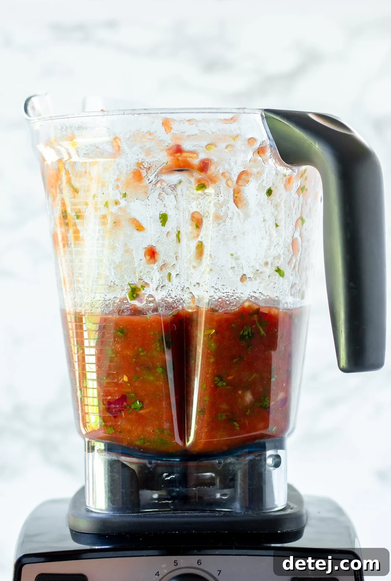 Effortless Fresh Salsa 4 A fresh batch of blended tomato salsa, showcasing its perfect chunky texture, inside a Vitamix blender, ready for serving.