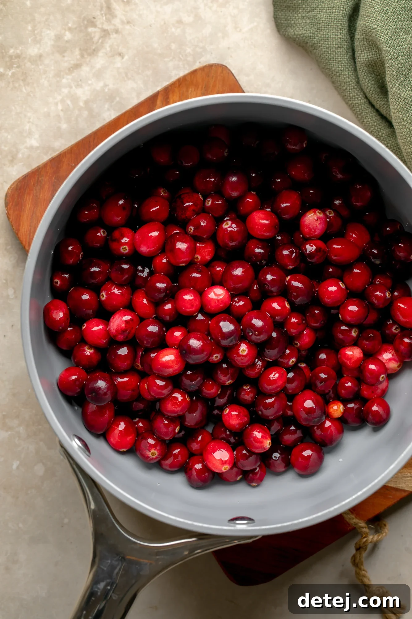 Ruby Orange Cranberry Delight 3 overhead view of fresh cranberries in a saucepan.