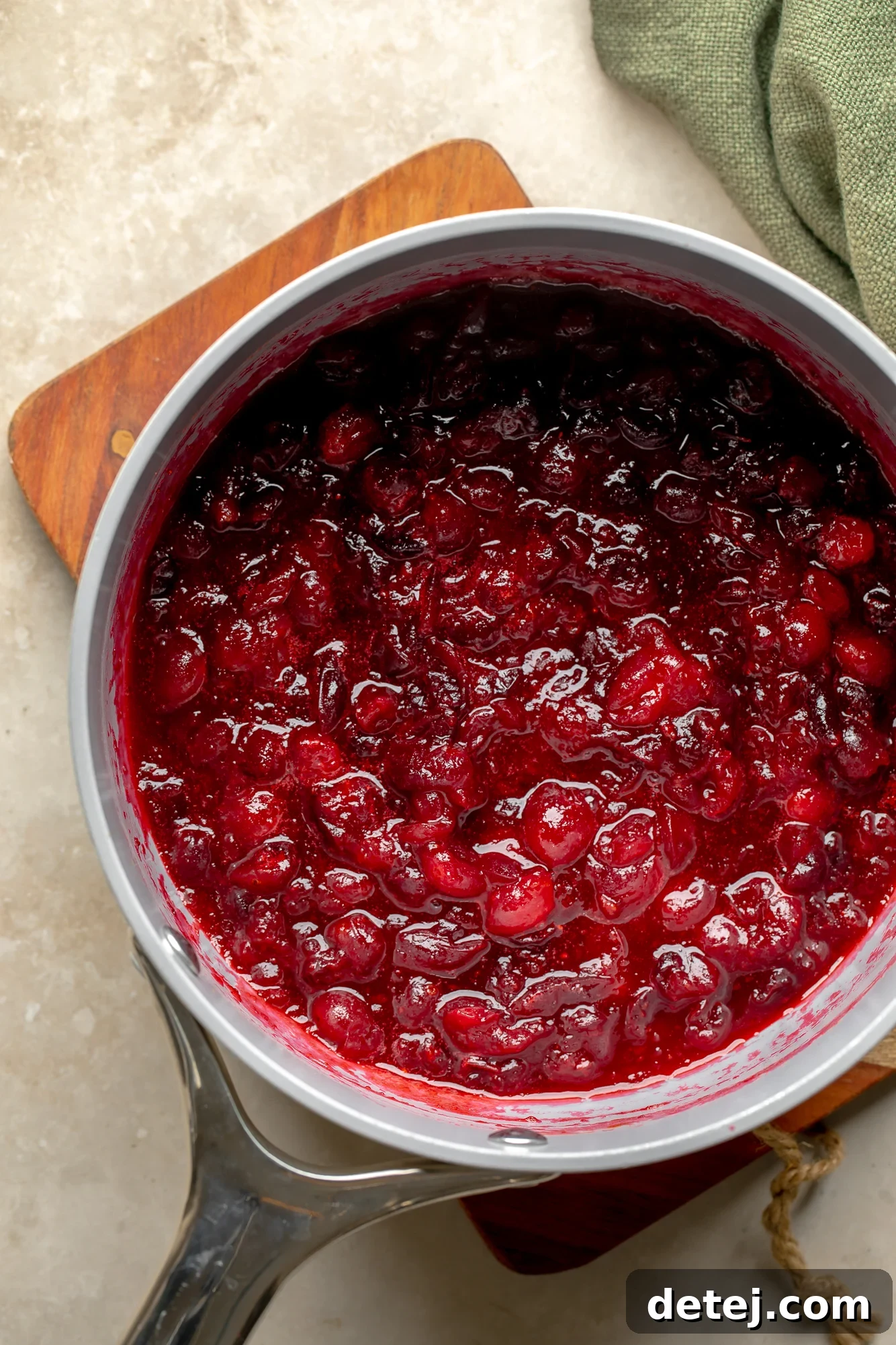 Ruby Orange Cranberry Delight 5 overhead view of orange cranberry sauce in a saucepan.