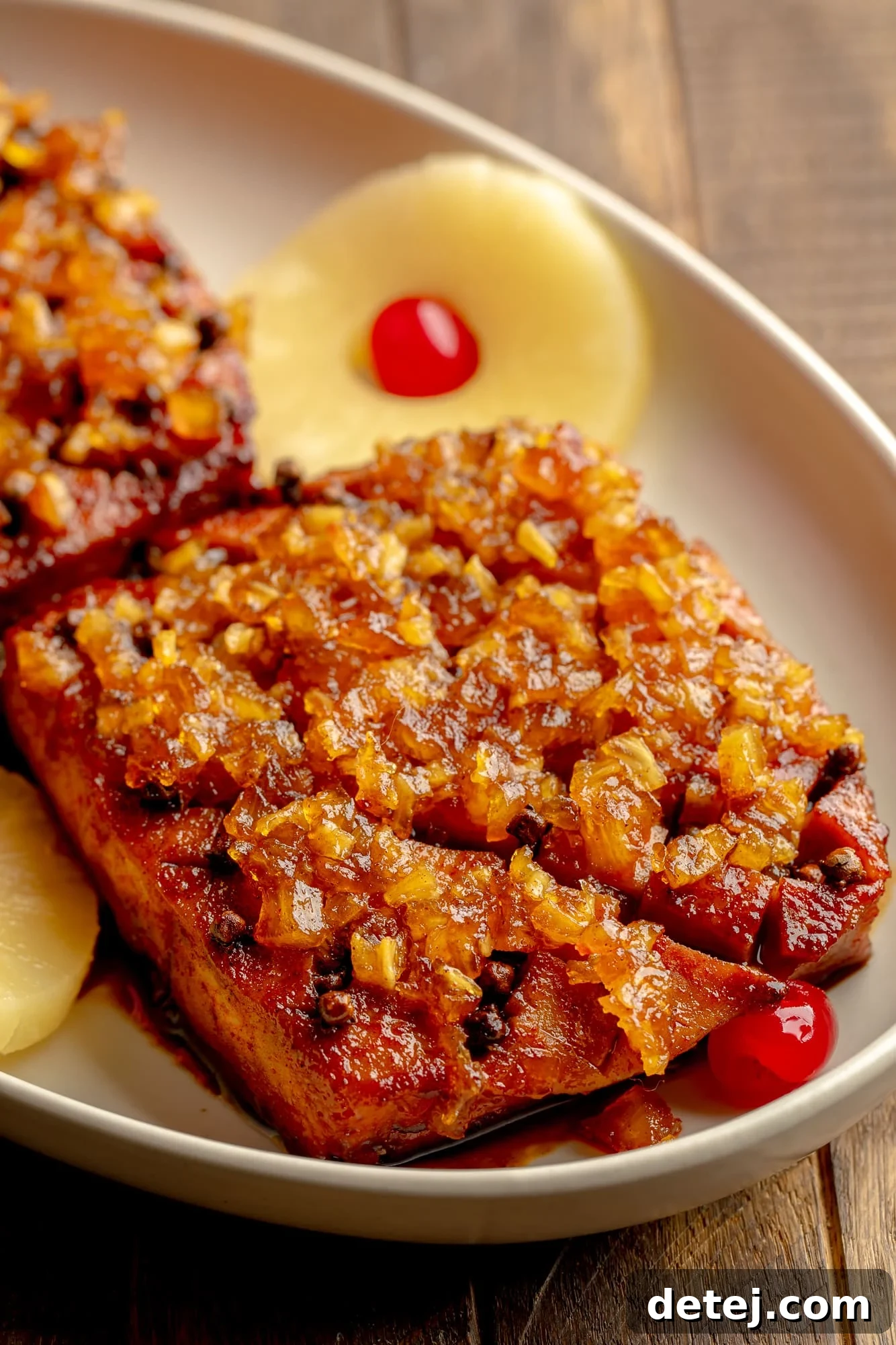 side view of a pineapple glazed tofu roast in a serving dish.