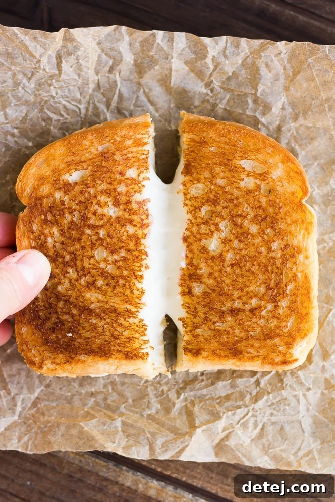 vegan grilled cheese sandwich being pulled apart