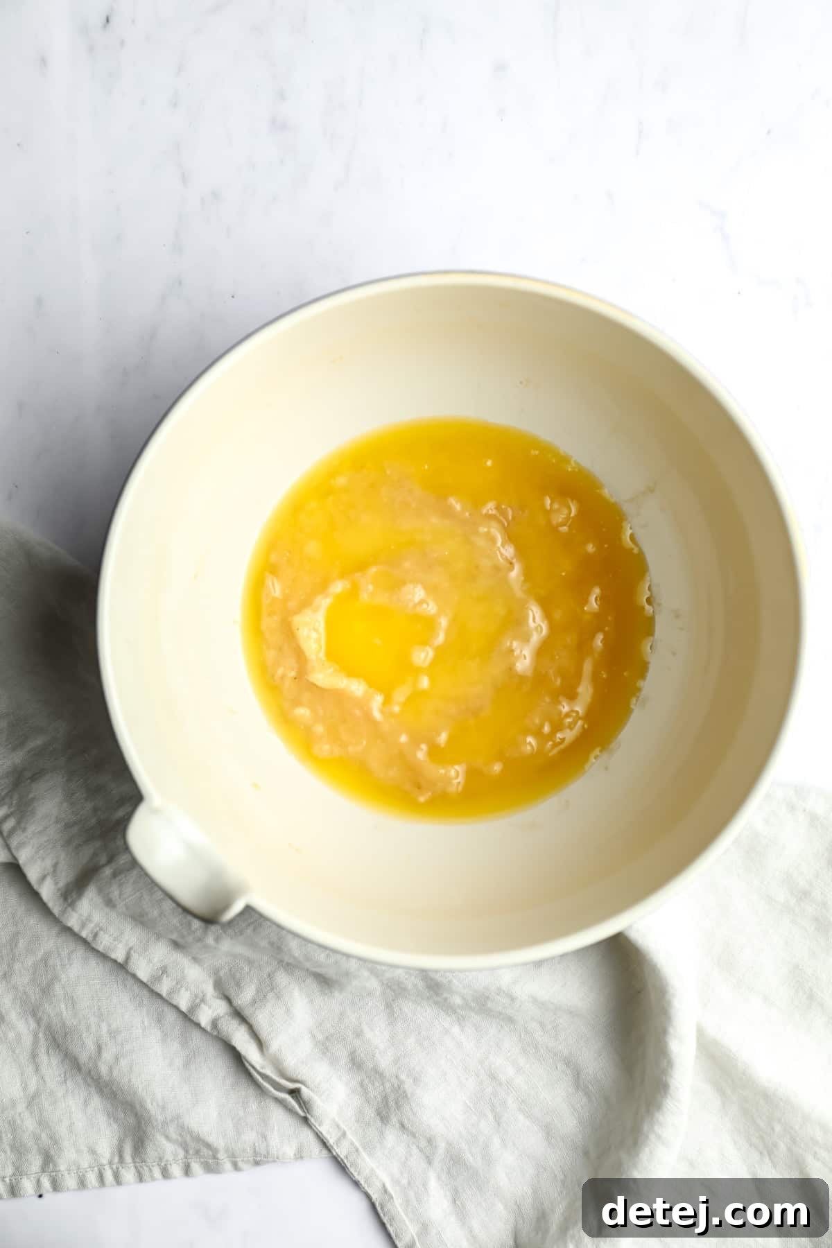 butter and mashed bananas in a bowl