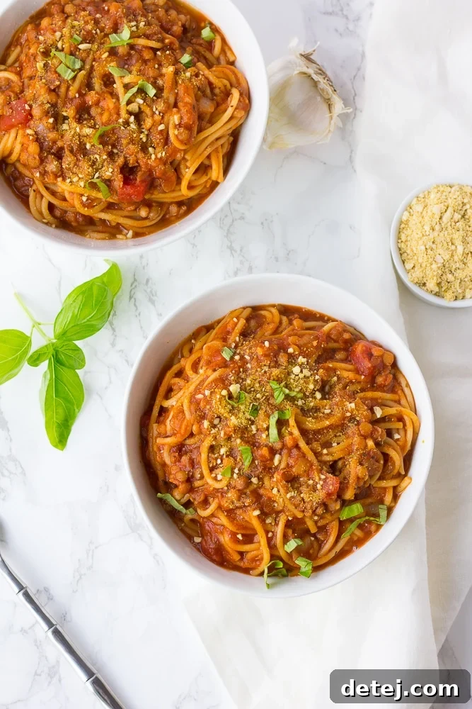 Two bowls of Instant Pot Spaghetti served, highlighting the fresh ingredients and inviting presentation