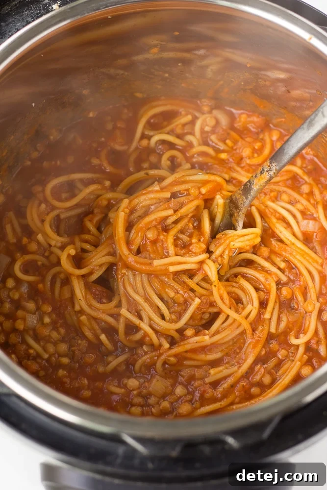 Instant Pot Spaghetti still in the Instant Pot after cooking, stirred and ready to be served