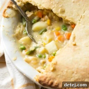 Classic Vegan Pot Pie, golden and flaky, served in a cast iron pan.