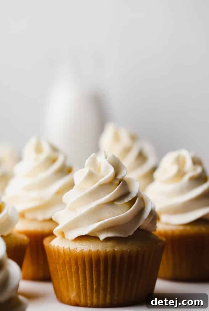 Dreamy Vegan Buttercream 2 Yellow cupcakes decorated with perfectly swirled vegan buttercream frosting