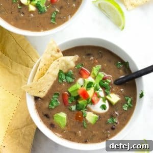 Square image of two bowls of vegan black bean soup