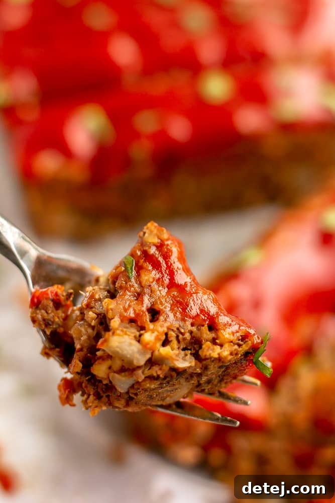 fork holding a bite of vegan meatloaf