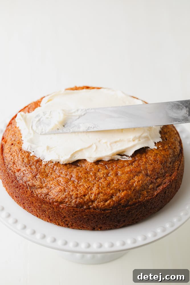 frosting being spread on a cake